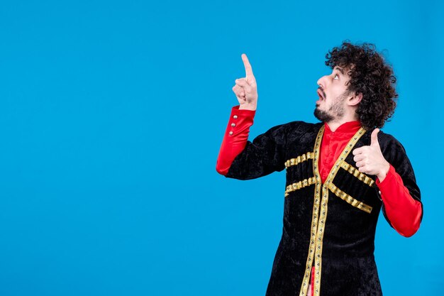 Portrait of azeri man in traditional costume studio shot blue background ethnic dancer spring concept novruz