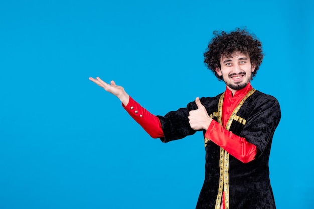 Portrait of azeri man in traditional costume studio shot blue background ethnic spring dancers novruz