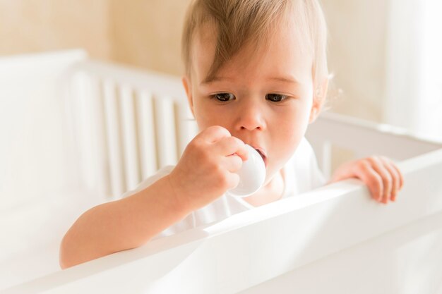 Portrait of baby in crib