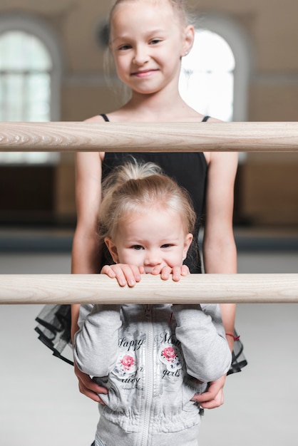 Portrait of ballerina girl with her little sister
