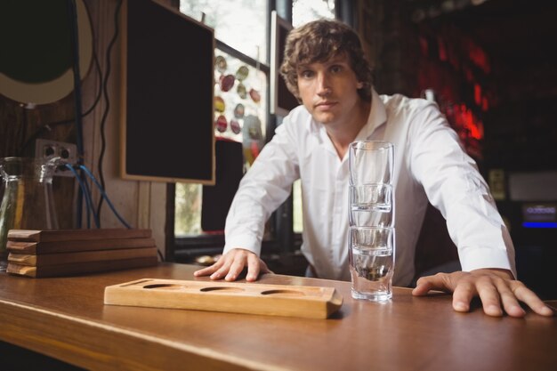 Portrait of bartender at bar counter