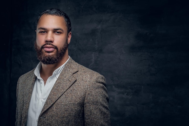 Portrait of bearded black man in a wool suit.