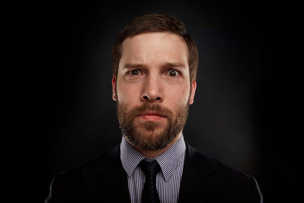 Portrait of bearded man wearing formal clothes