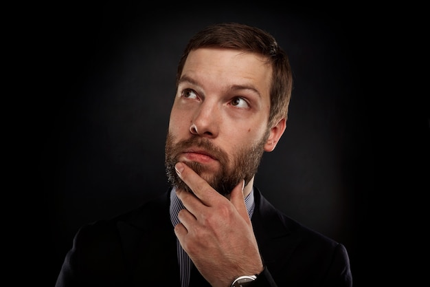 Portrait of bearded man wearing formal clothes