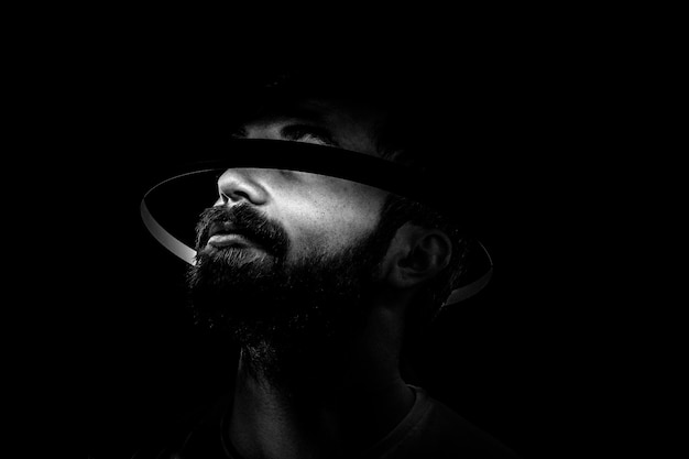 Portrait of bearded man with light circle around head