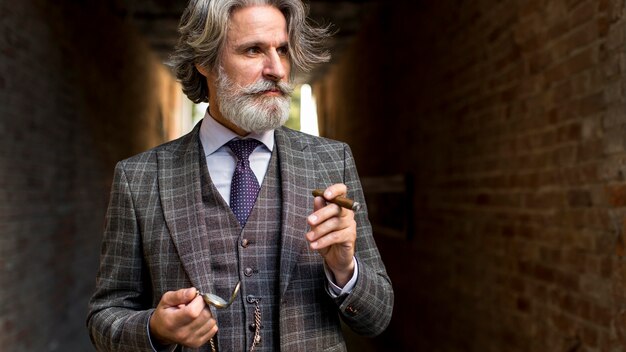 Portrait of bearded mature male looking away