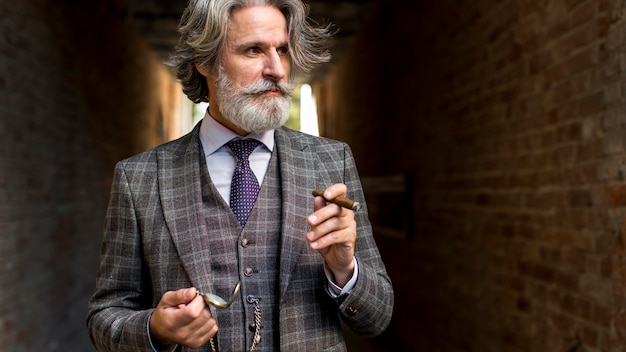 Portrait of bearded mature male looking away