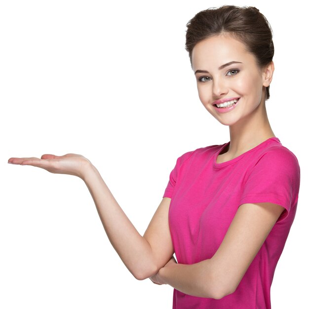 Portrait of a beautiful adult happy woman with presentation gesture