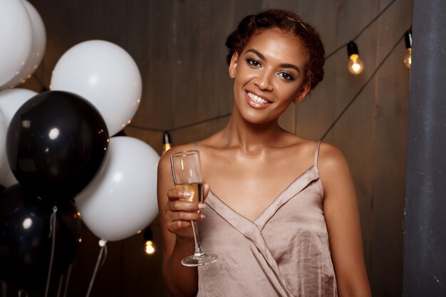 Portrait of beautiful african girl resting at party.