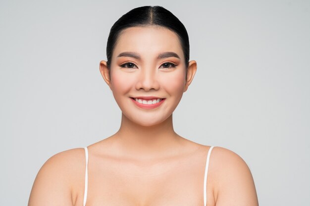 Portrait of beautiful asian woman with black hair and pink lips