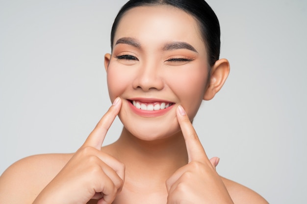 Portrait of beautiful asian woman with black hair and pink lips