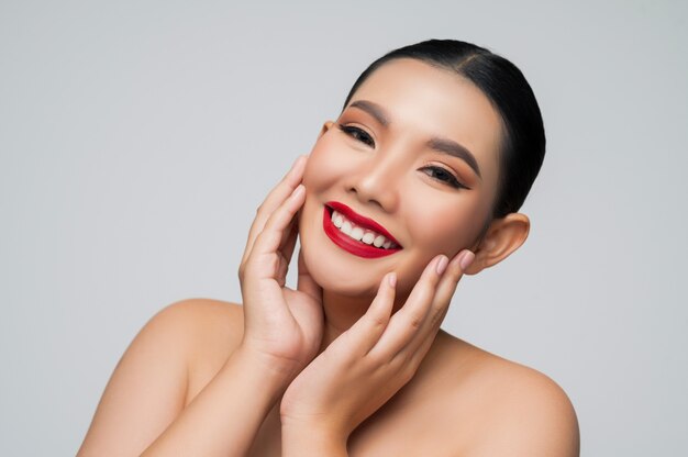 Portrait of beautiful asian woman with black hair and red lips