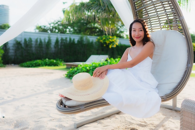 Portrait beautiful asian women around beach sea ocean with happy smile