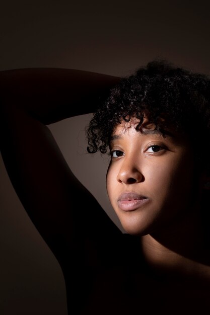 Portrait of beautiful black woman with mysterious shadows