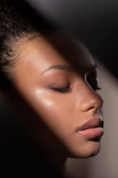 Portrait of beautiful black woman with mysterious shadows