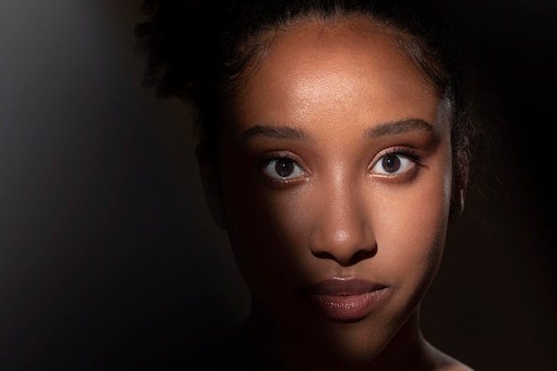 Portrait of beautiful black woman with mysterious shadows