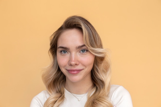 Portrait of beautiful blond woman with trendy hairstyle