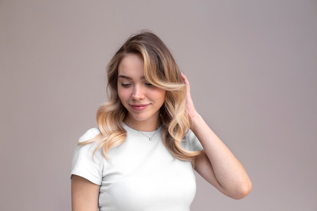 Portrait of beautiful blond woman with trendy hairstyle