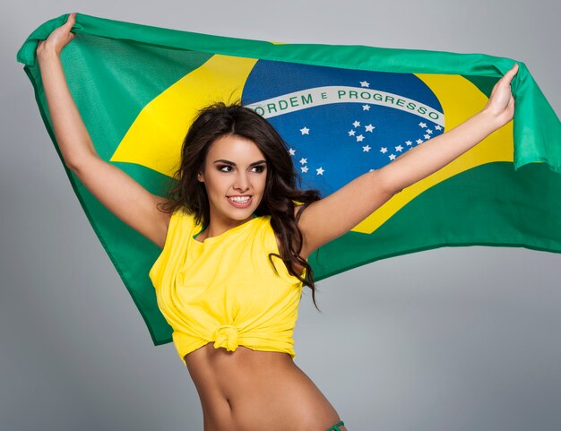 Portrait of beautiful brazilian football fan 
