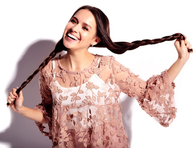 Portrait of beautiful caucasian smiling brunette woman model in bright pink summer stylish clothes isolated on white background. 