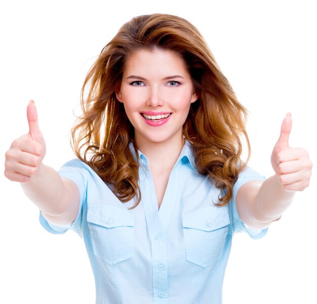 Portrait of a beautiful cheerful happy woman with thumbs up sign over white background.