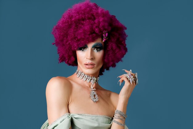 Portrait of beautiful drag person wearing makeup and wig