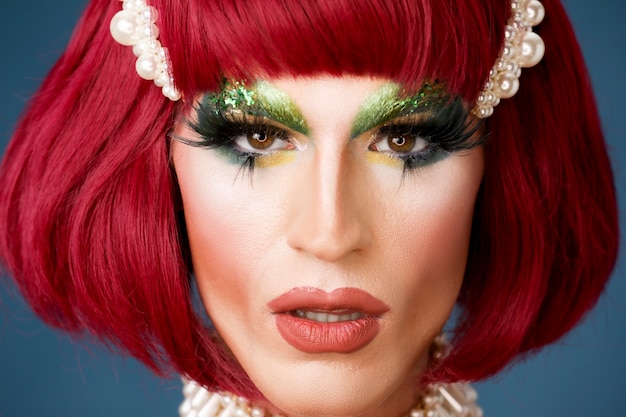 Portrait of beautiful drag person wearing makeup and wig