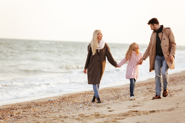 Portrait of a beautiful family with a little daughter