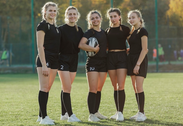 Free photo portrait of beautiful female rugby players