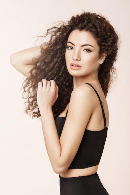 Portrait of beautiful girl  over pink wall