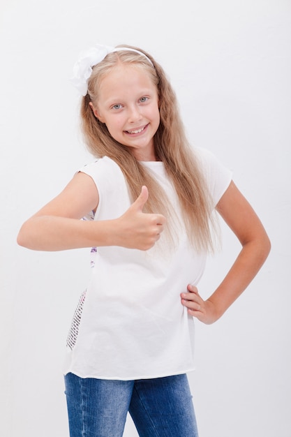 Portrait of a beautiful girl showing thumbs up