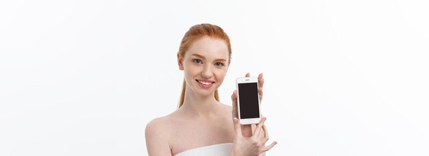 Portrait of beautiful girl with phone conversation isolated on light white background