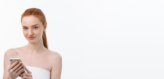 Portrait of beautiful girl with phone conversation isolated on light white background