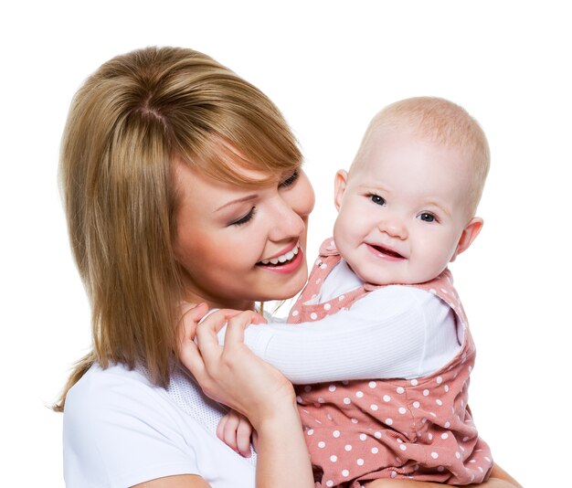 Portrait of a beautiful happy mother with baby  isolated on white