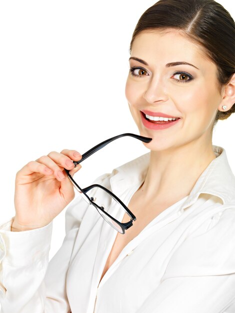 Portrait of a beautiful happy smiling woman with glasses in hands- isolated on white background
