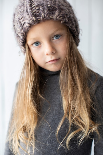 Portrait of beautiful little girl with blue eyes