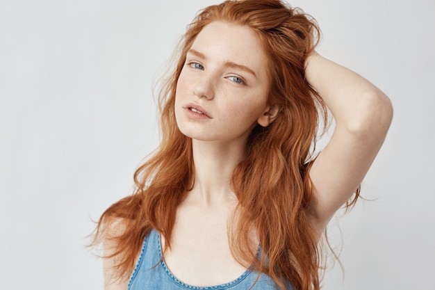 Portrait of beautiful model with foxy hair posing 