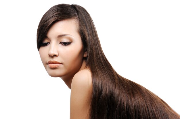 Portrait of beautiful pretty young girl with long smooth luxuriant hairs