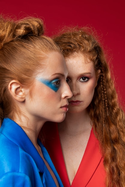 Portrait of beautiful redhaired women wearing make-up