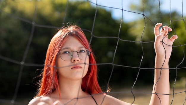 Portrait of beautiful redhead girl with glasses