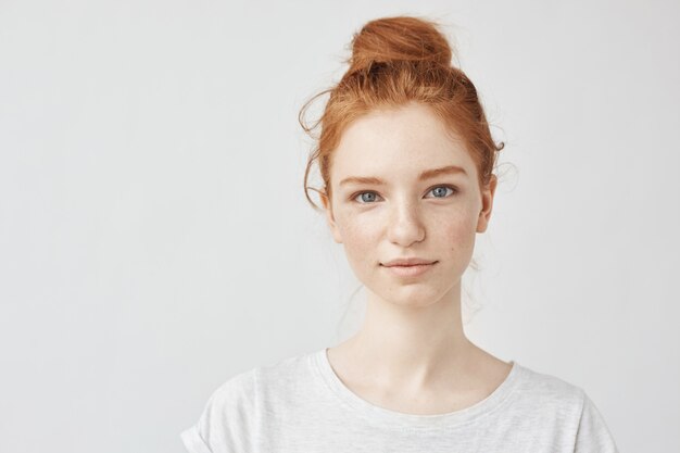 Portrait of beautiful redhead woman smiling.