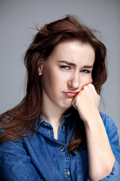 The portrait of a beautiful sad girl closeup