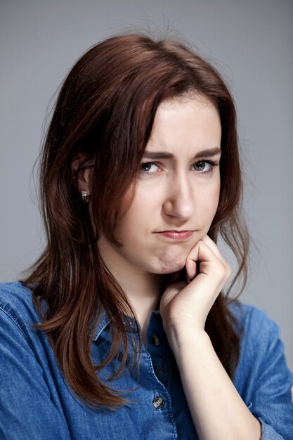 The portrait of a beautiful sad girl closeup