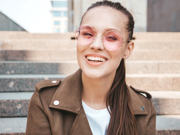 Portrait of beautiful smiling brunette model dressed in summer hipster jacket clothes. 