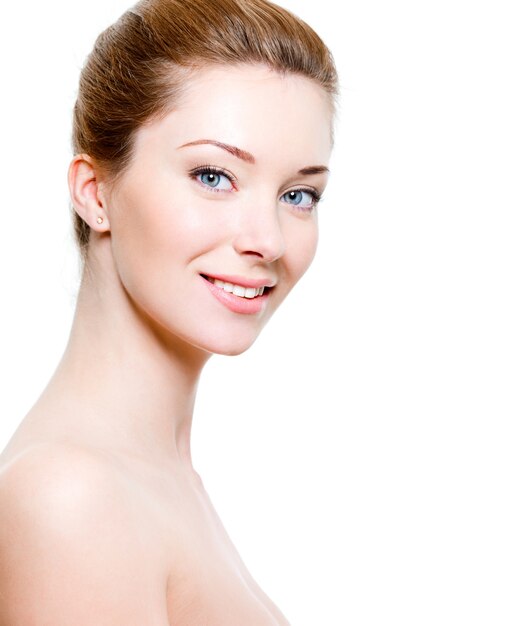 Portrait of beautiful smiling woman with healthy skin