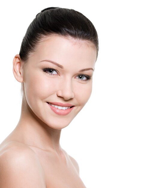 Portrait of beautiful smiling woman with healthy skin