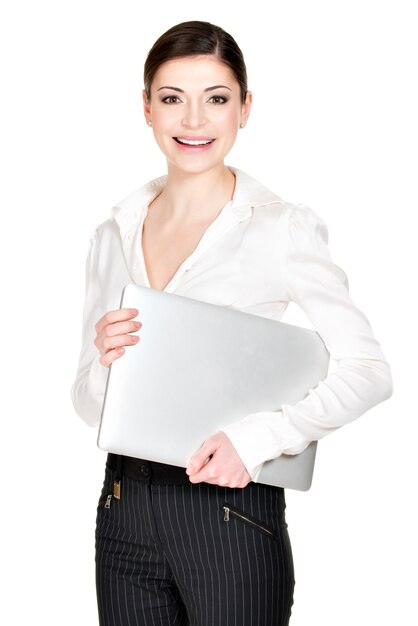 Portrait of a  beautiful smiling woman with laptop in white shirt - isolated on white. 
