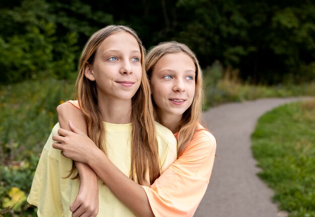 Portrait of beautiful twin sisters