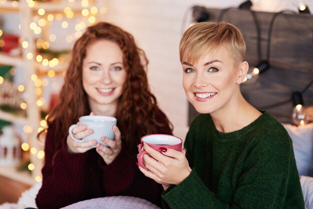 Portrait of beautiful woman drinking hot tea