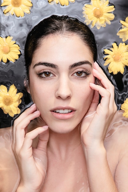 Portrait of beautiful woman enjoying skincare treatment